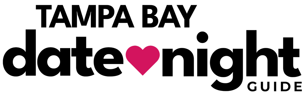 Logo for Tampa Bay Date Night Guide, featuring a modern font with 'Tampa Bay' at the top, 'date' and 'night' in the center separated by a red heart, and 'guide' at the bottom right. Tampa Bay Date Night Guide is part of the Date Night Guide network and a sister site of Orlando Date Night Guide, offering ideas for local date experiences. Tampa Bay Date Night Guide is part of Hooray Media at https://hooray.media